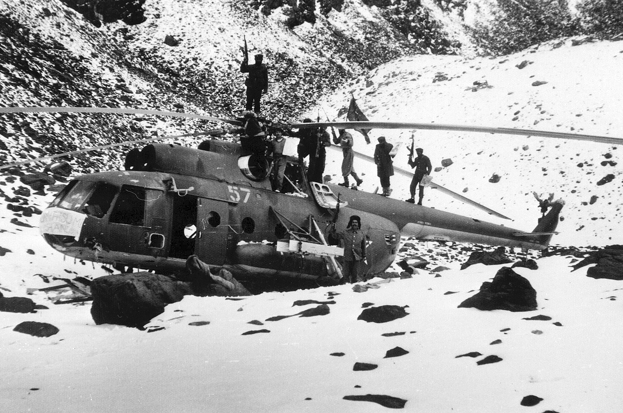 Afghan guerrillas on top of a crashed Mi-24 near Kabul